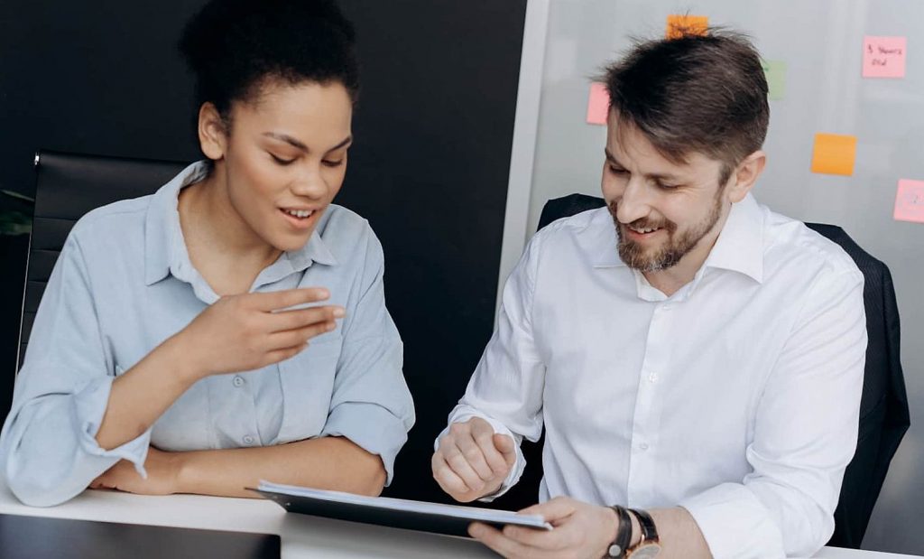 Woman and man are playing online on tablet